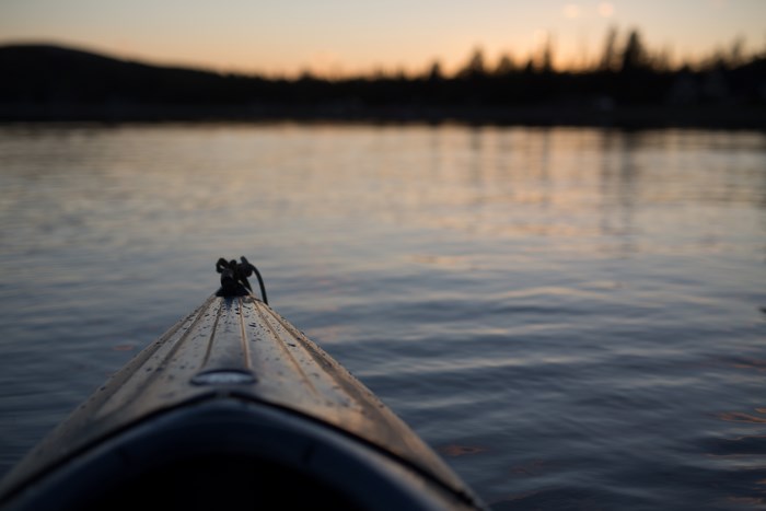 Kayak on a lake at sunset