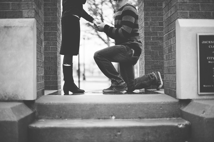 Man proposes to woman on steps
