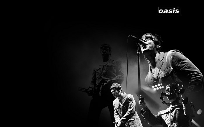 Oasis band members performing on stage