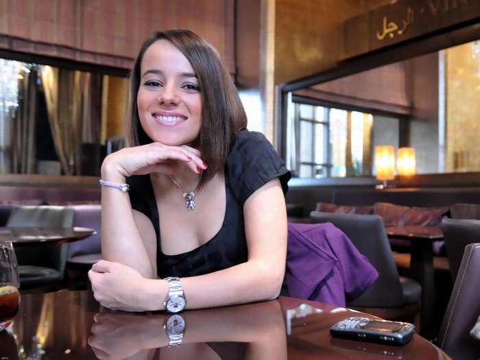 Alizee sitting at a table in a restaurant