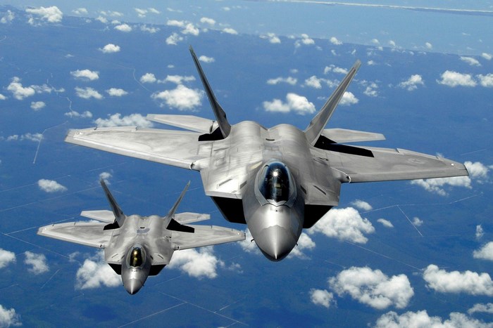 Two Lockheed Martin F-22 Raptors in flight