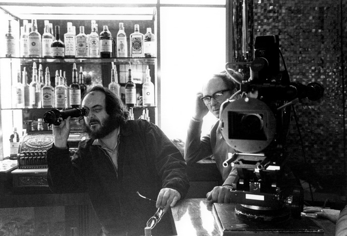 Stanley Kubrick with camera and bottles