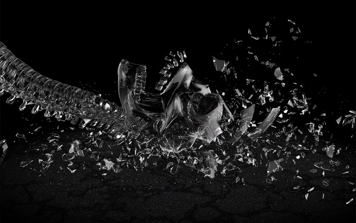 Shattered glass skull and spine on black background