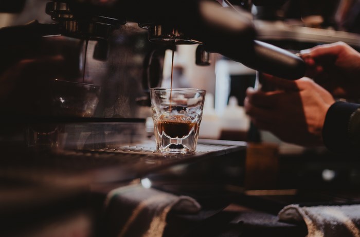 Barista Pouring Espresso Coffee in Café