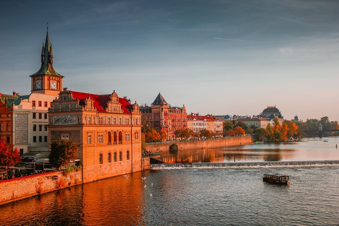 Prague Old Town buildings along the Vltava River at sunset