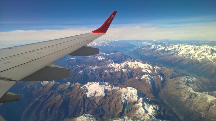 Stunning Aerial View of Snow-Capped Mountains from Airplane