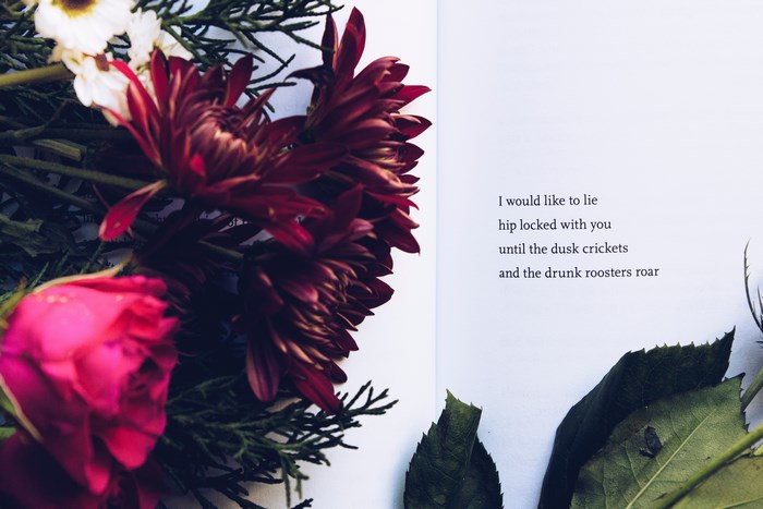 Poetry book with flowers and a quote