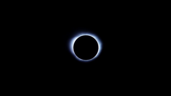 Solar eclipse with glowing corona