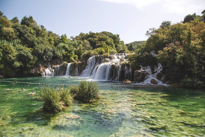 Scenic Waterfall and Clear Green River in Plitvice Park