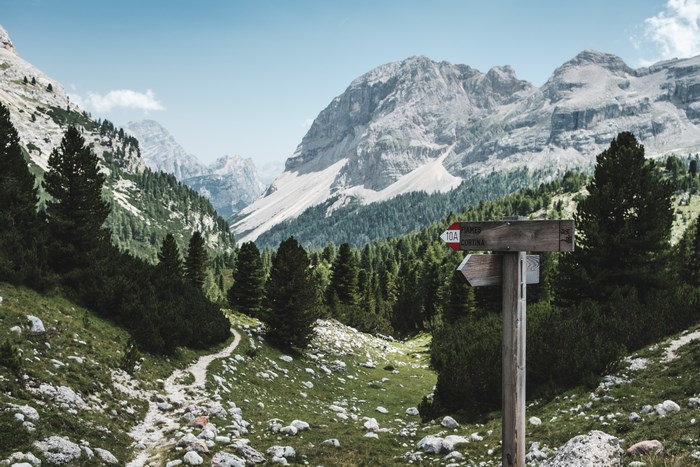 Mountain trail signpost in the Dolomites, Italy