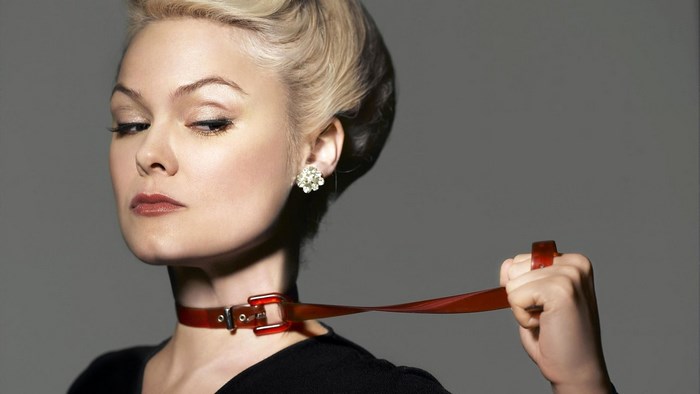Anja Garbarek with a red collar and leash