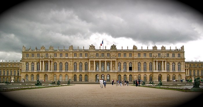 Palace of Versailles under a cloudy sky