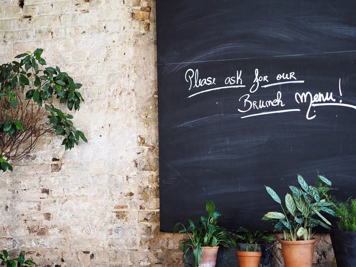 Chalkboard menu in a cafe with plants