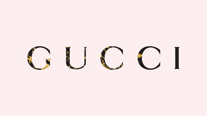 Gucci logo on a pink background