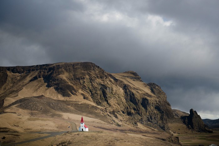 Church on a hill in Iceland under a cloudy sky