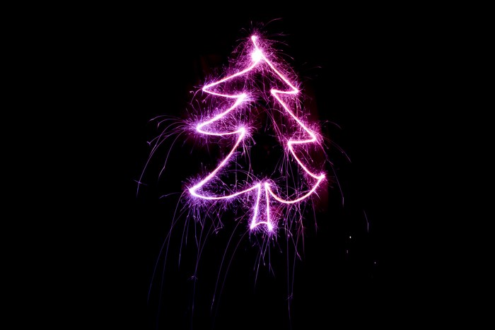 Pink Light Drawing of a Christmas Tree at Night