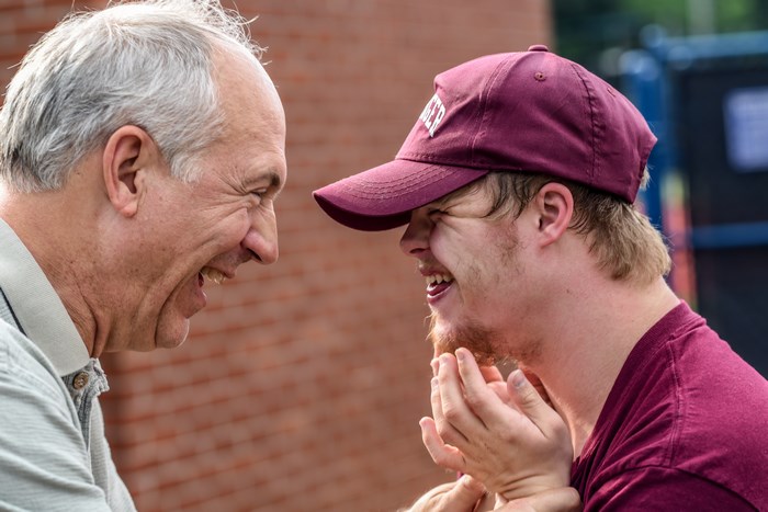Joyful Moment Between Father and Son with Down Syndrome