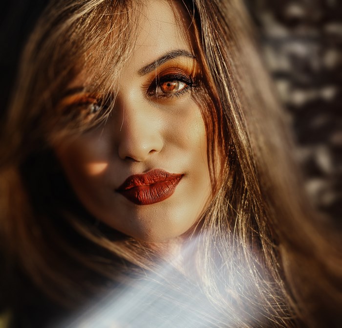 Woman with red lips and brown hair in Morocco