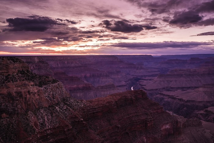 Grand Canyon at sunset with purple clouds