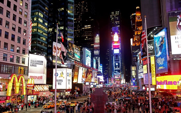 Times Square at Night with Billboards and Crowds