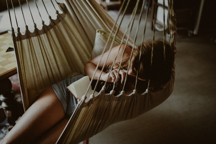Woman reading in a hammock