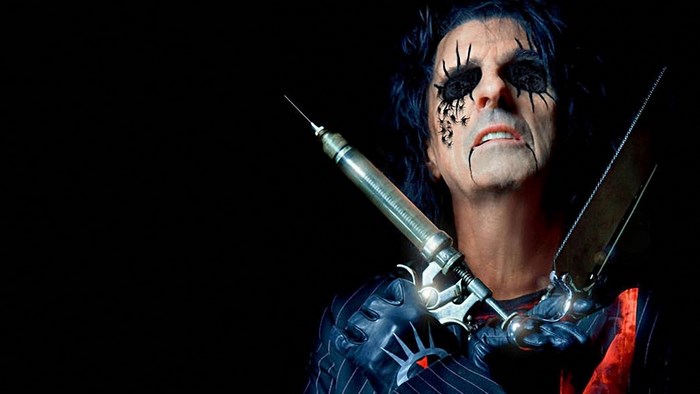 Alice Cooper with syringe and saw