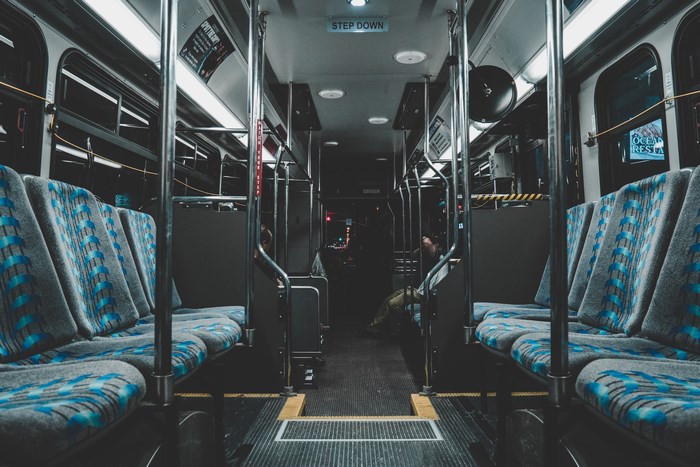 Interior of a bus with blue seats