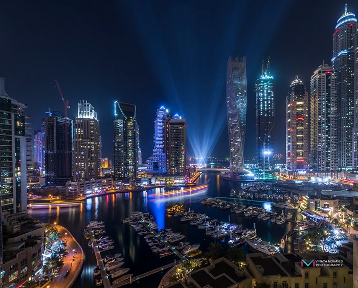 Dubai Marina skyscrapers and yachts at night