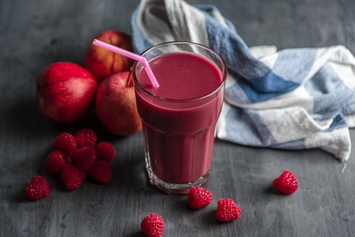 Raspberry smoothie with apples and a towel