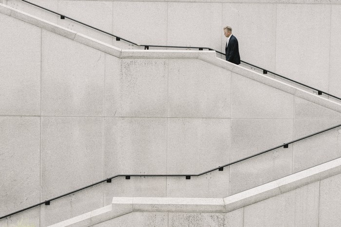 Man in Suit Walking Up Stairs in Nashville