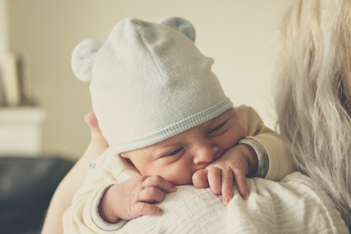 Newborn Baby Resting on Mother's Shoulder