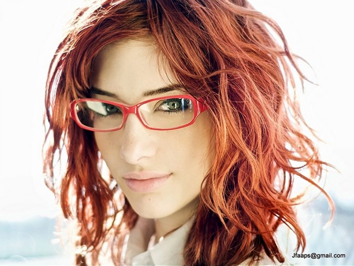 Susan Coffey with red hair and glasses