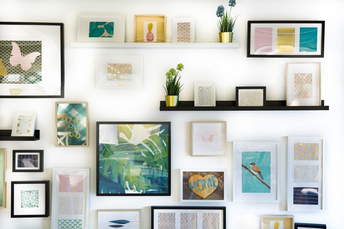 Wall art with framed pictures and plants