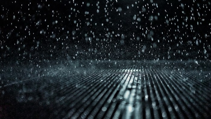 Rain falling on a metal grate