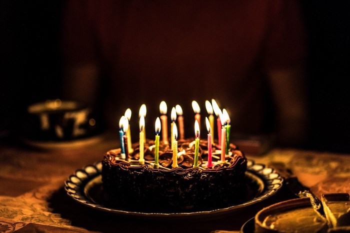 Lit Birthday Cake with Colorful Candles
