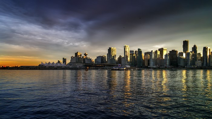 Vancouver skyline at sunset with water reflection