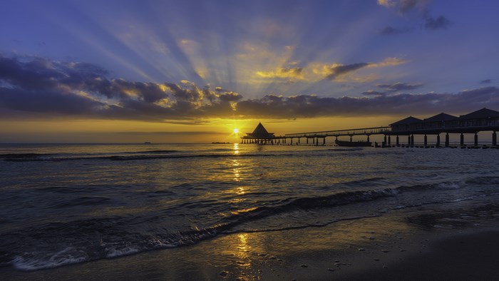 4K Sunset over the Ocean with Pier
