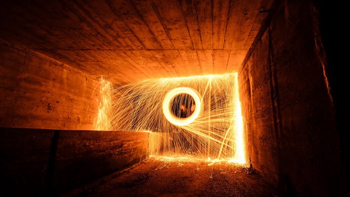 4K steel wool photography in concrete tunnel