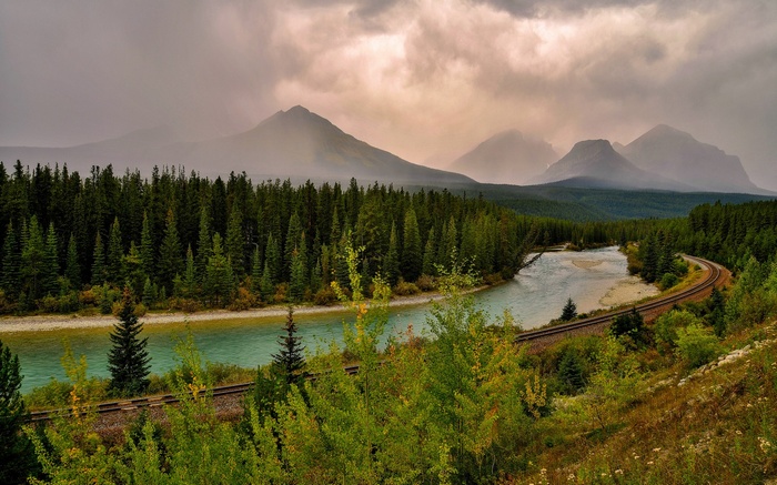 River and mountains with a train track