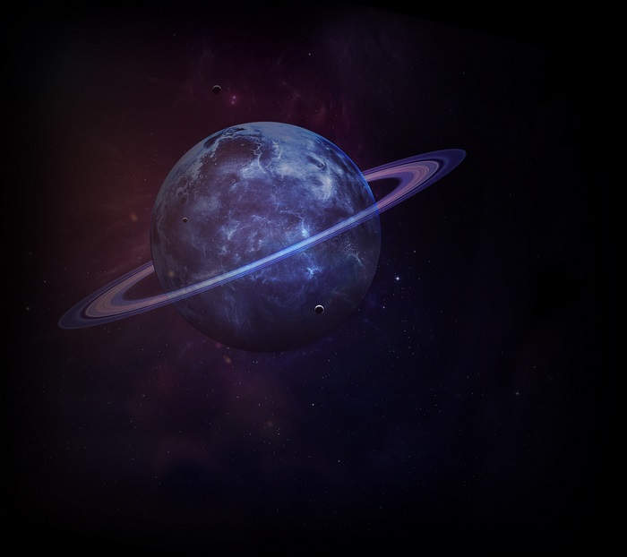 Saturn with rings and moons in space