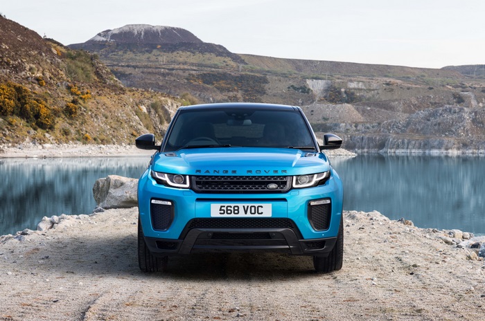 Blue Range Rover Evoque by a lake