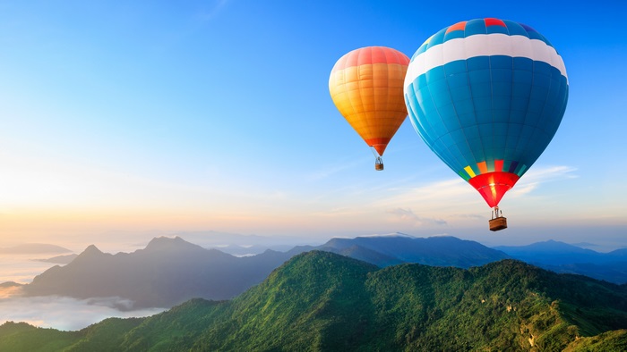Hot Air Balloons Over Mountains at Sunrise 4K