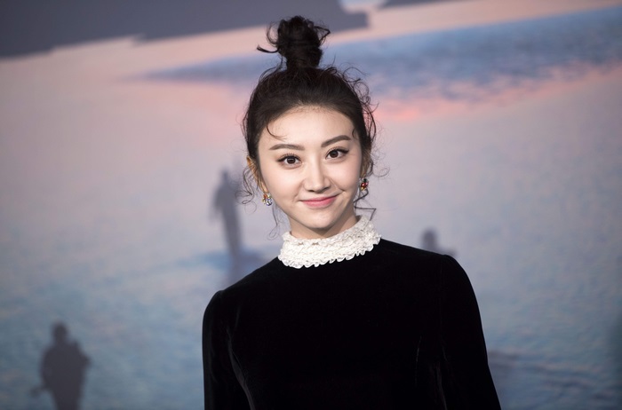 Tian Jing in black dress with white collar