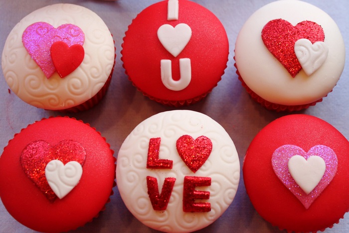 Valentine's Day cupcakes with hearts and text