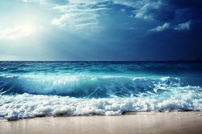 Calm Ocean Wave Under Dramatic Sky 4K