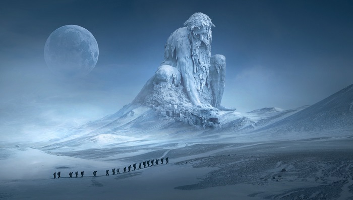 Giant ice statue in snowy landscape with moon