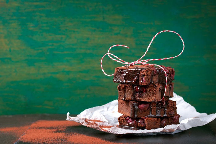 Stack of cherry brownies with chocolate glaze