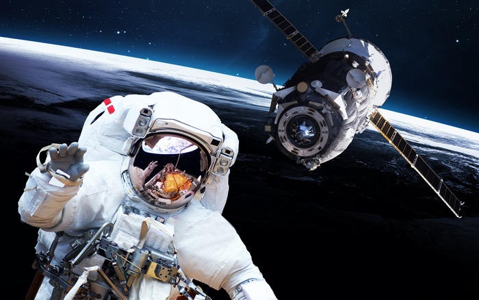 Astronaut and Spacecraft Orbiting Earth 4K