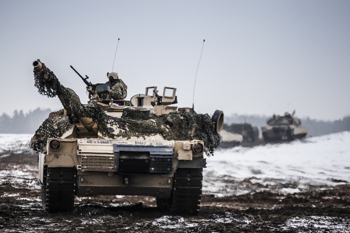 M1 Abrams tanks in a snowy landscape
