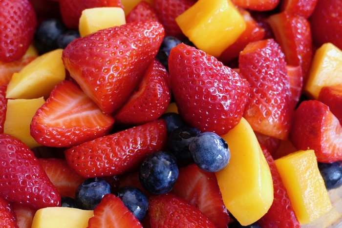 Fruit salad with strawberries, blueberries, and mango